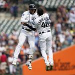 
              Detroit Tigers' Victor Reyes, left, celebrates his two-run double with Jeimer Candelario (46) against the San Diego Padres in the ninth inning of a baseball game in Detroit, Wednesday, July 27, 2022. Detroit won 4-3. (AP Photo/Paul Sancya)
            