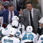 
              FILE - San Jose Sharks head coach Bob Boughner, top right, talks to his team as assistant John Madden, left, looks on during the third period of an NHL hockey game against the Chicago Blackhawks in Chicago, Sunday, Nov. 28, 2021. The San Jose Sharks have abruptly fired coach Bob Boughner and his staff two months after the regular season ended. The team confirmed the moves Friday, July 1, 2022, after reports surfaced Boughner and assistants John MacLean and John Madden were informed Thursday night they were being let go. (AP Photo/Nam Y. Huh, File)
            