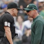 
              Oakland Athletics manger Mark Kotsay, right, argues with home plate umpire Chris Segal after Kotsay was ejected during an at-bat by Seattle Mariners' Julio Rodriguez during the sixth inning of a baseball game Saturday, July 2, 2022, in Seattle. (AP Photo/Ted S. Warren)
            