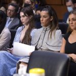 
              FILE - United States gymnasts from left, Simone Biles, McKayla Maroney, Aly Raisman and Maggie Nichols, arrive to testify during a Senate Judiciary hearing about the Inspector General's report on the FBI's handling of the Larry Nassar investigation on Capitol Hill, Sept. 15, 2021, in Washington. The FBI has reached out to attorneys representing Olympic gold medalist Simone Biles and other women who say they were sexually assaulted by Larry Nassar to begin settlement talks in the $1 billion claim they brought against the federal government, according to three people familiar with the matter. (Saul Loeb/Pool via AP, File)
            