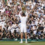 
              Serbia's Novak Djokovic celebrates with the trophy after beating Australia's Nick Kyrgios in the final of the men's singles on day fourteen of the Wimbledon tennis championships in London, Sunday, July 10, 2022. (AP Photo/Kirsty Wigglesworth)
            