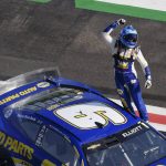 
              NASCAR Cup Series driver Chase Elliott (9) celebrates after winning a NASCAR Cup Series auto race at Atlanta Motor Speedway, Sunday, July 10, 2022, in Hampton, Ga. (AP Photo/Bob Andres)
            