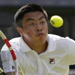 
              Brandon Nakashima of the US returns to Australia's Nick Kyrgios in a men's singles fourth round match on day eight of the Wimbledon tennis championships in London, Monday, July 4, 2022. (AP Photo/Alberto Pezzali)
            