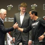 
              Miami Heat president Pat Riley, left, shakes hands with head coach Erik Spoelstra, right, as Nikola Jovic, of Serbia, center, looks on during a news conference, Monday, June 27, 2022, in Miami. Jovic was selected by the Miami Heat as the No. 27 pick in the 2022 NBA draft. (AP Photo/Lynne Sladky)
            