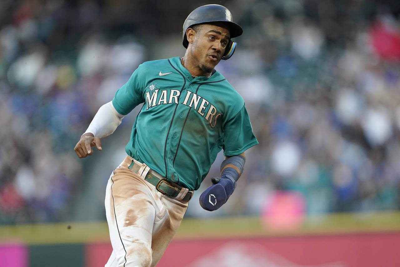 Eugenio Suarez of the Seattle Mariners reacts after his walk-off News  Photo - Getty Images