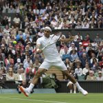 
              FILE - Roger Federer of Switzerland volleys a return to Victor Hanescu of Romania during their Men's first round singles match at the All England Lawn Tennis Championships in Wimbledon, London, Monday, June 24, 2013. (AP Photo/Anja Niedringhaus, File)
            