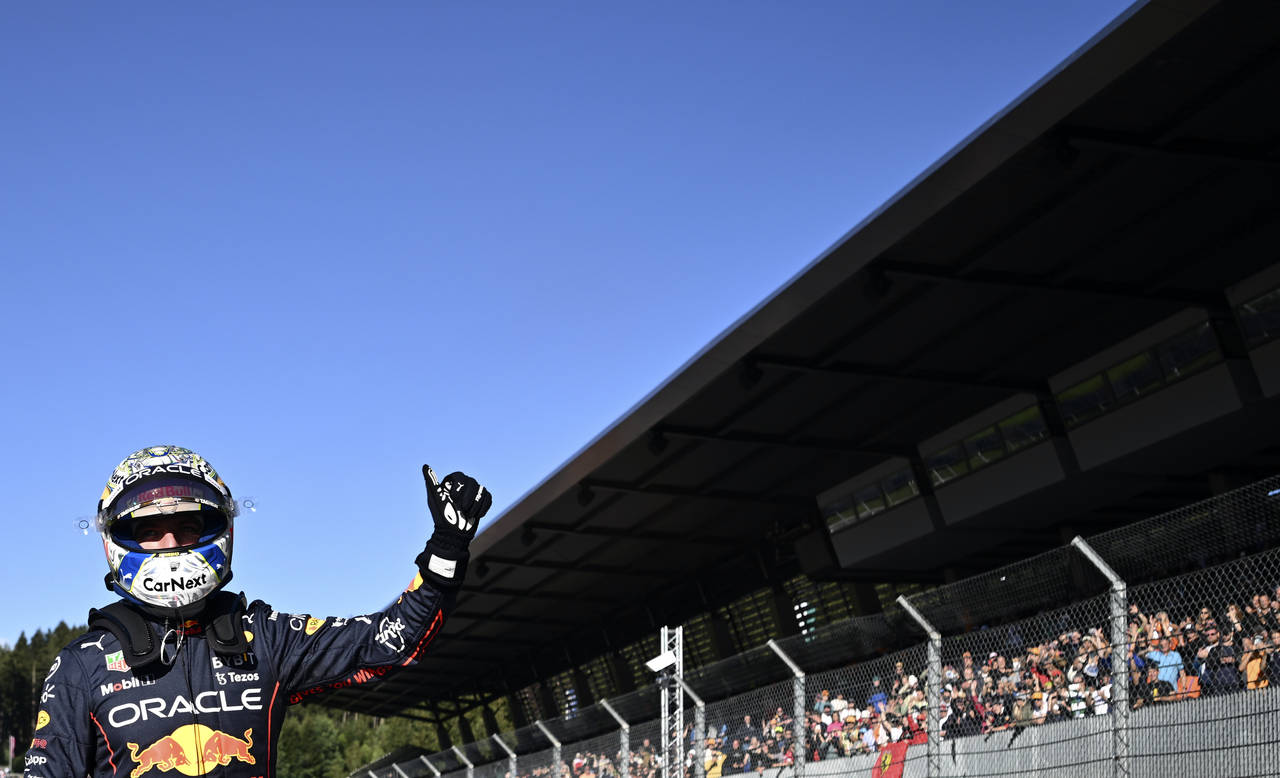 Red Bull driver Max Verstappen of the Netherlands celebrates after he clocked the fastest time duri...