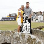 
              England's Nick Faldo and his former caddie Fanny Sunneson poses for a photo on the Swilken Bridge during a 'Champions round' as preparations continue for the British Open golf championship on the Old Course at St. Andrews, Scotland, Monday July 11, 2022. The Open Championship returns to the home of golf on July 14-17, 2022, to celebrate the 150th edition of the sport's oldest championship, which dates to 1860 and was first played at St. Andrews in 1873. (AP Photo/Peter Morrison)
            