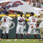 
              From left to right, Atlanta Braves outfielders Eddie Rosario, Guillermo Heredia, Ronald Acuna Jr. (13) and team mascot 'Blooper' celebrate a win over the Washington Nationals in a baseball game Saturday, July 9, 2022, in Atlanta. (AP Photo/Ben Margot)
            