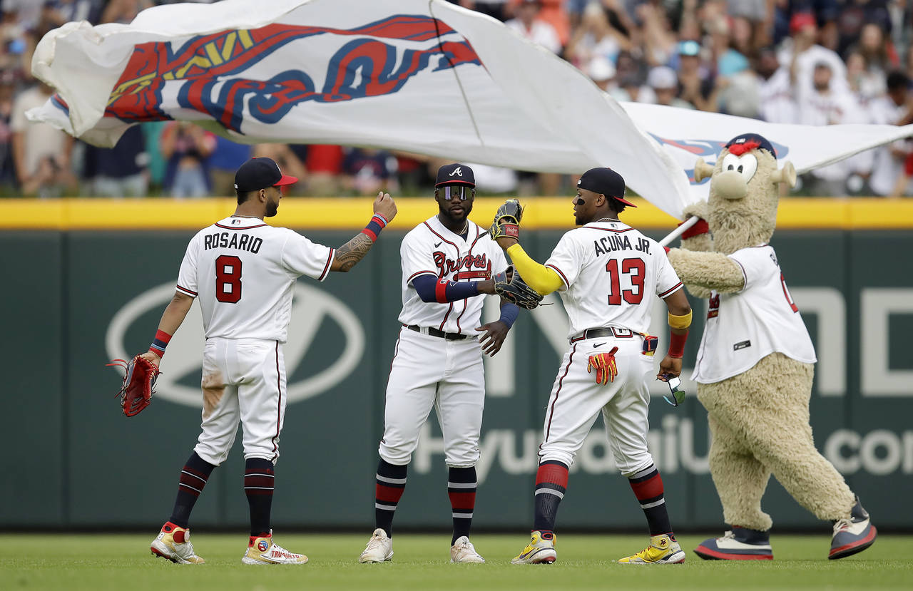 From left to right, Atlanta Braves outfielders Eddie Rosario, Guillermo Heredia, Ronald Acuna Jr. (...
