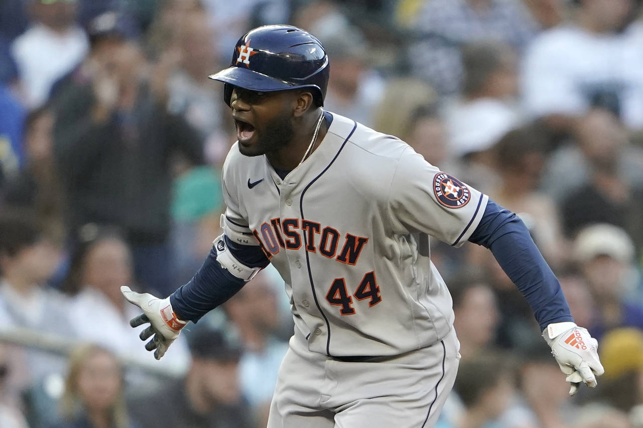 Houston Astros' Yordan Alvarez reacts as he rounds the bases after he hit a solo home run during th...
