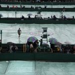 
              Rain covers are placed on the courts on day one of the Wimbledon tennis championships in London, Monday, June 27, 2022. (AP Photo/Alastair Grant)
            