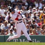 
              Boston Red Sox's Trevor Story hits a solo homer during the fourth inning of a baseball game against the Tampa Bay Rays at Fenway Park, Monday, July 4, 2022, in Boston. (AP Photo/Mary Schwalm)
            