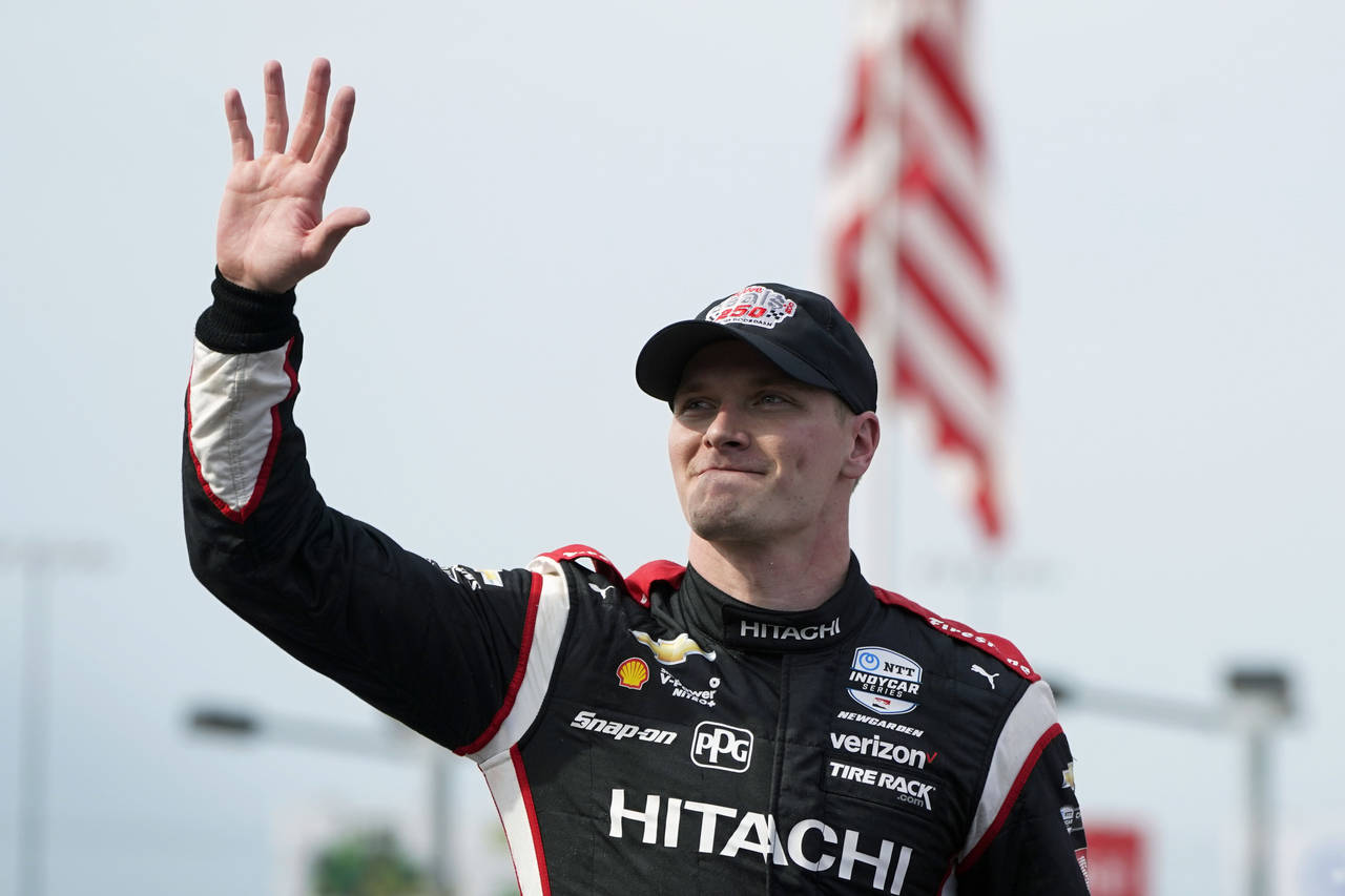 Josef Newgarden waves after winning the IndyCar Series auto race Saturday, July 23, 2022, at Iowa S...