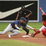 
              Toronto Blue Jays' Vladimir Guerrero Jr, right, slides into second base ahead of a tag by Tampa Bay Rays' second baseman Isaac Paredes for a two-run double in the third inning of a baseball game in Toronto on Friday July 1, 2022. (Jon Blacker/The Canadian Press via AP)
            