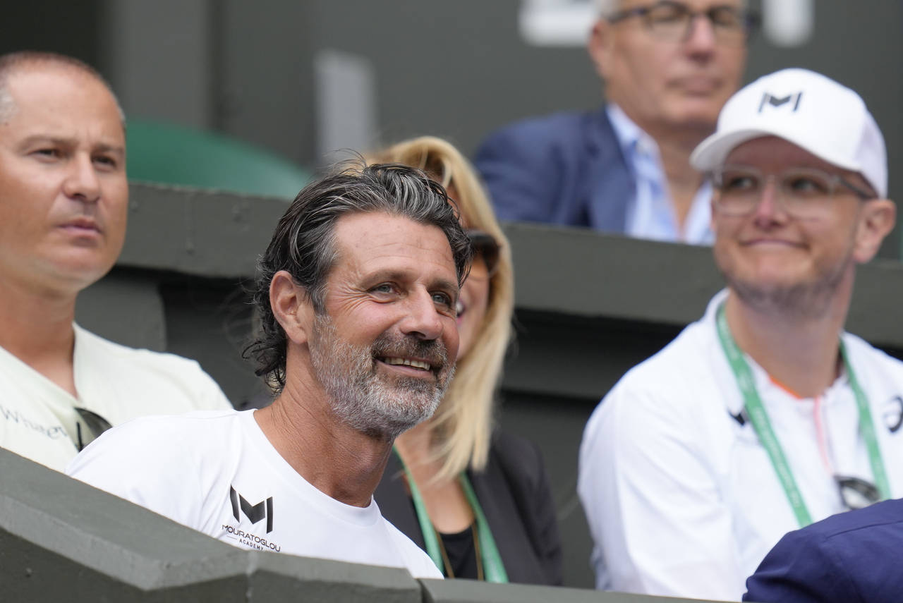 Patrick Mouratoglou, the coach of Romania's Simona Halep sits in the players box for her match agai...