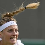 
              Petra Kvitova of the Czech Republic returns the ball to Italy's Jasmine Paolini during their singles tennis match on day two of the Wimbledon tennis championships in London, Tuesday, June 28, 2022. (AP Photo/Kirsty Wigglesworth)
            