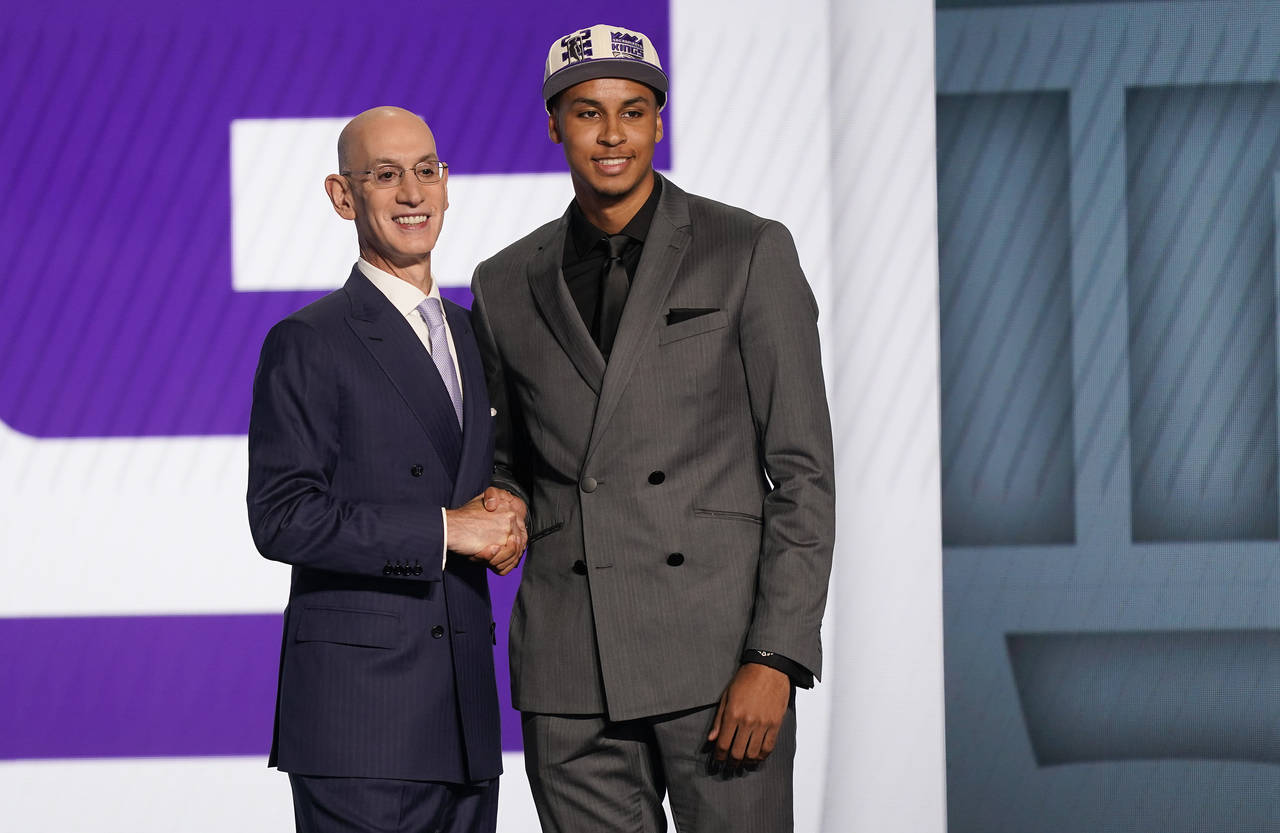 Keegan Murray, right, poses for photos with NBA Commissioner Adam Silver after being selected fourt...