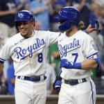 
              Kansas City Royals' Bobby Witt Jr. (7) celebrates with teammate Nicky Lopez (8) after his two-run home run in the eighth inning against the Tampa Bay Rays during a baseball game Saturday, July 23, 2022, in Kansas City, Mo. (AP Photo/Ed Zurga)
            
