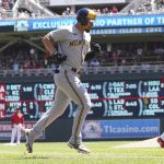 
              Milwaukee Brewers' Jace Peterson jogs home after hitting a solo home run off Minnesota Twins pitcher Joe Ryan, right, in the third inning of a baseball game, Wednesday, July 13, 2022, in Minneapolis. (AP Photo/Jim Mone)
            