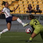 
              United States' Mallory Pugh, left, and Haiti's goalkeeper Lara Larco battle for the ball during a CONCACAF Women's Championship soccer match in Monterrey, Mexico, Monday, July 4, 2022. (AP Photo/Fernando Llano)
            