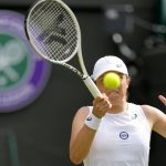 
              Poland's Iga Swiatek returns the ball to France's Alize Cornet during a third round women's singles match on day six of the Wimbledon tennis championships in London, Saturday, July 2, 2022. (AP Photo/Kirsty Wigglesworth)
            