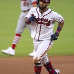 
              Atlanta Braves' Eddie Rosario runs the bases after hitting a home run in the fifth inning of the team's baseball game against the St. Louis Cardinals on Wednesday, July 6, 2022, in Atlanta. (AP Photo/Edward M. Pio Roda)
            