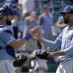 
              Kansas City Royals catcher Cam Gallagher and relief pitcher Joel Payamps (38) celebrate after their baseball game against the Cleveland Guardians Sunday, July 10, 2022, in Kansas City, Mo. The Royals won 5-1. (AP Photo/Charlie Riedel)
            