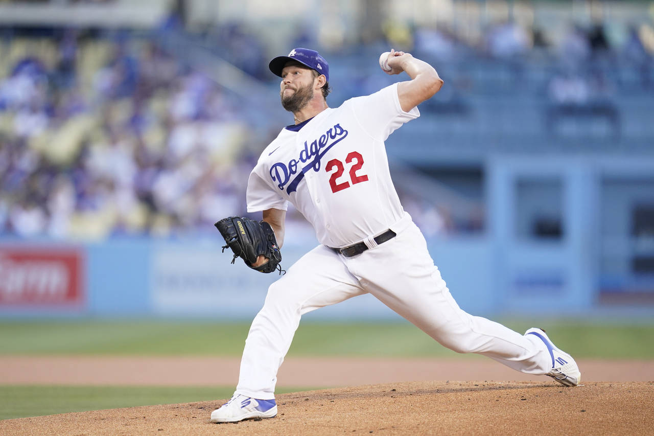 Los Angeles Dodgers starting pitcher Clayton Kershaw (22) throws during the first inning of a baseb...