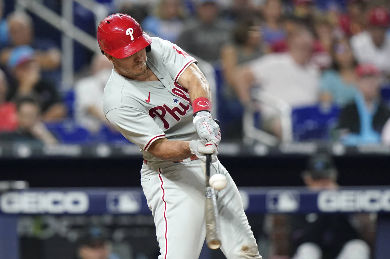 Philadelphia Phillies' J.T. Realmuto hits a single during the ninth inning of the team's baseball g...