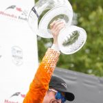 
              Scott Dixon, of New Zealand, lifts his trophy after winning an IndyCar auto race in Toronto, Sunday, July 17, 2022. (Andrew Lahodynskyj/The Canadian Press via AP)
            