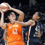 
              Team Wilson's Brionna Jones, left, shoots against Team Stewart's Skylar Diggins-Smith during the second half of a WNBA All-Star basketball game in Chicago, Sunday, July 10, 2022. (AP Photo/Nam Y. Huh)
            