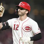 
              Cincinnati Reds' Tyler Naquin (12) reacts after hitting a solo home run during the sixth inning of the second baseball game of a doubleheader against the Pittsburgh Pirates, Thursday, July 7, 2022, in Cincinnati. (AP Photo/Jeff Dean)
            