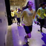 SEATTLE, WASHINGTON - AUGUST 07: Sue Bird #10 of the Seattle Storm makes her way to the court before her last regular season home game of her career against the Las Vegas Aces at Climate Pledge Arena on August 07, 2022 in Seattle, Washington. (Photo by Steph Chambers/Getty Images)