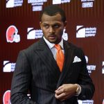 
              FILE - Cleveland Browns quarterback Deshaun Watson enters a news conference at the NFL football team's training facility, on March 25, 2022, in Berea, Ohio. The NFL suspended Watson for six games on Monday, Aug. 1, 2022 for violating its personal conduct policy following accusations of sexual misconduct made against him by two dozen women in Texas, two people familiar with the decision said. (AP Photo/Ron Schwane, File)
            