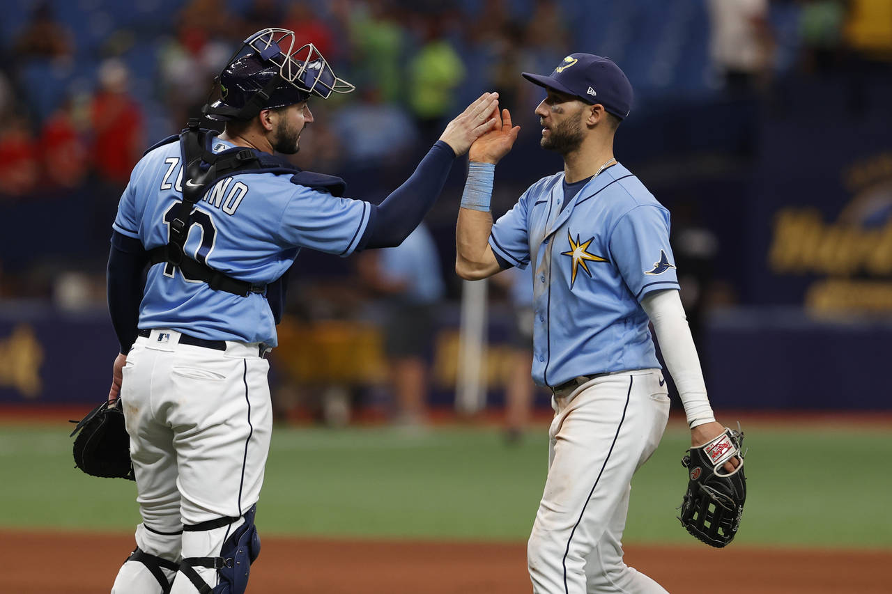 FILE - Tampa Bay Rays center fielder Kevin Kiermaier, right, celebrates with catcher Mike Zunino af...