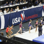 
              Signage showing the new USA Gymnastics logo is displayed during the 2022 U.S. Gymnastics Championships, Friday, Aug. 19, 2022, in Tampa, Fla.(AP Photo/Mike Carlson)
            
