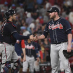 
              Atlanta Braves relief pitcher Tyler Matzek (68), right, and teammate Travis d'Arnaud (16) celebrate their teams 11-4 victory over the St. Louis Cardinals in a baseball game on Friday, Aug. 26, 2022, in St. Louis. (AP Photo/Joe Puetz)
            