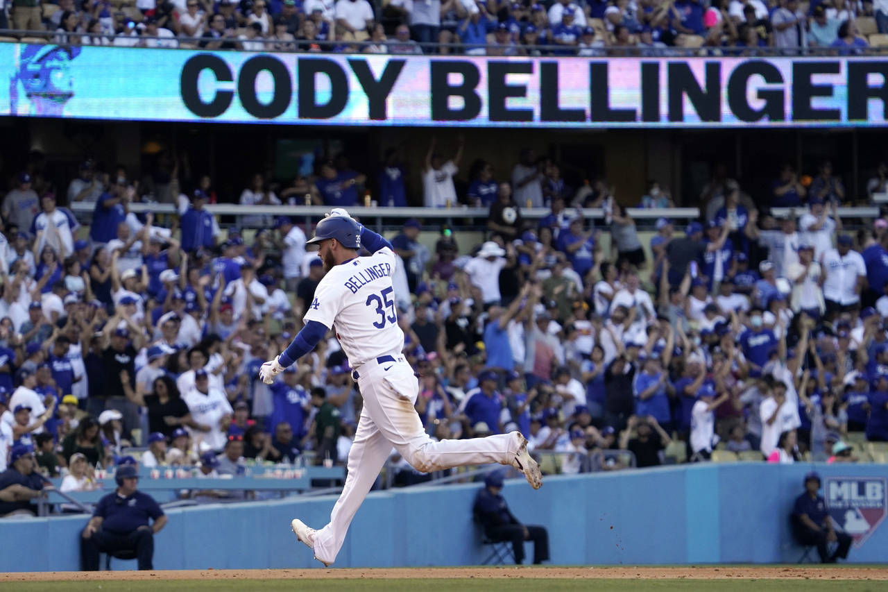 Los Angeles Dodgers' Cody Bellinger rounds third after hitting a solo home run during the seventh i...