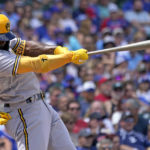 
              Milwaukee Brewers' Andrew McCutchen hits a two-run home run against the Chicago Cubs during the first inning of a baseball game in Chicago, Friday, Aug. 19, 2022. (AP Photo/Nam Y. Huh)
            