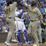 
              San Diego Padres' Wil Myers, right, celebrates with Josh Bell after hitting a two-run home run during the second inning of a baseball game against the Kansas City Royals Saturday, Aug. 27, 2022, in Kansas City, Mo. (AP Photo/Charlie Riedel)
            