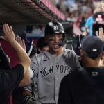 
              New York Yankees' Aaron Judge is congratulated by teammates in the dugout after hitting a three-run home run during the fourth inning of a baseball game against the Los Angeles Angels Tuesday, Aug. 30, 2022, in Anaheim, Calif. (AP Photo/Mark J. Terrill)
            