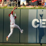 
              St. Louis Cardinals center fielder Dylan Carlson catches a fly ball by Colorado Rockies' Brendan Rodgers to end the top of the first inning of a baseball game Wednesday, Aug. 17, 2022, in St. Louis. (AP Photo/Jeff Roberson)
            