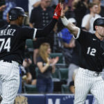 
              Chicago White Sox's Romy Gonzalez, right, celebrates with Eloy Jimenez after scoring against the Kansas City Royals during the seventh inning of a baseball game Wednesday, Aug. 31, 2022, in Chicago. (AP Photo/Kamil Krzaczynski)
            