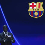 
              Ivorian coach and former player Yaya Toure shows the name of Barcelona during the soccer Champions League draw in Istanbul, Turkey, Thursday, Aug. 25, 2022. (AP Photo/Emrah Gurel)
            