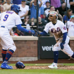 
              New York Mets' Brandon Nimmo and Francisco Lindor celebrate after scoring during the third inning of a baseball game against the Atlanta Braves, Sunday, Aug. 7, 2022, in New York. (AP Photo/Julia Nikhinson)
            