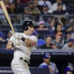 
              New York Yankees' Andrew Benintendi's RBI double scores Isiah Kiner-Falefa in the fifth inning of a baseball game against the New York Mets, Monday, Aug. 22, 2022, in New York. (AP Photo/Corey Sipkin)
            