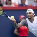 
              Nick Kyrgios of Australia returns to Daniil Medvedev during second round play at the National Bank Open tennis tournament Wednesday Aug. 10, 2022. in Montreal. (Paul Chiasson/The Canadian Press via AP)
            