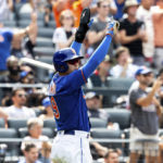 
              New York Mets' Brandon Nimmo raises his hands in celebration after scoring during the seventh inning of a baseball game against the Cincinnati Reds, Wednesday, Aug. 10, 2022, in New York. (AP Photo/Julia Nikhinson)
            