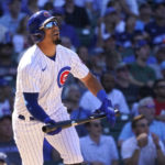 
              Chicago Cubs' Rafael Ortega watches his sacrifice fly scoring P.J. Higgins during the seventh inning of a baseball game against the Washington Nationals Wednesday, Aug. 10, 2022, in Chicago. (AP Photo/Charles Rex Arbogast)
            